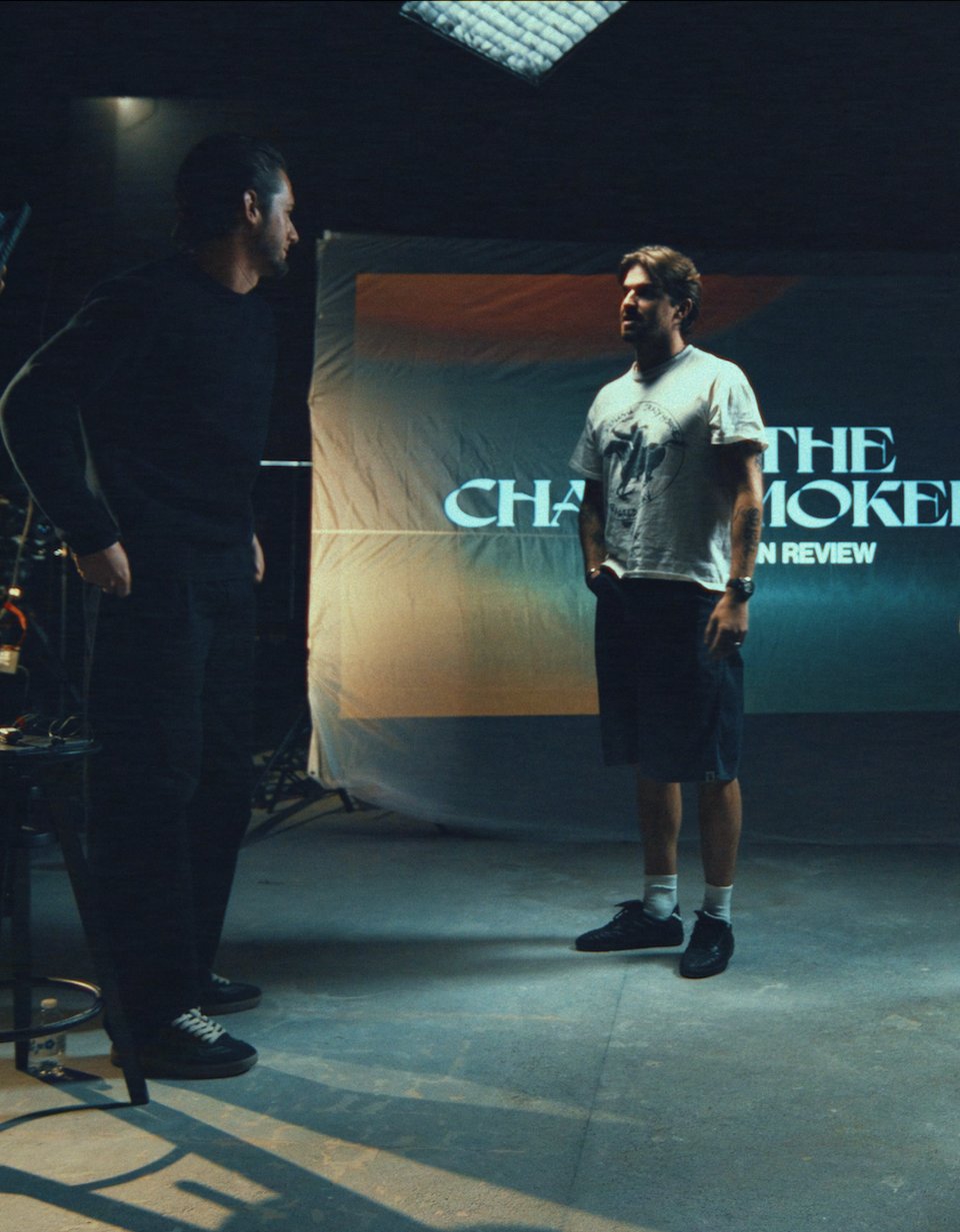 Alex Schenberg and Drew Taggart beside the archival screening setup inside XS Las Vegas during construction